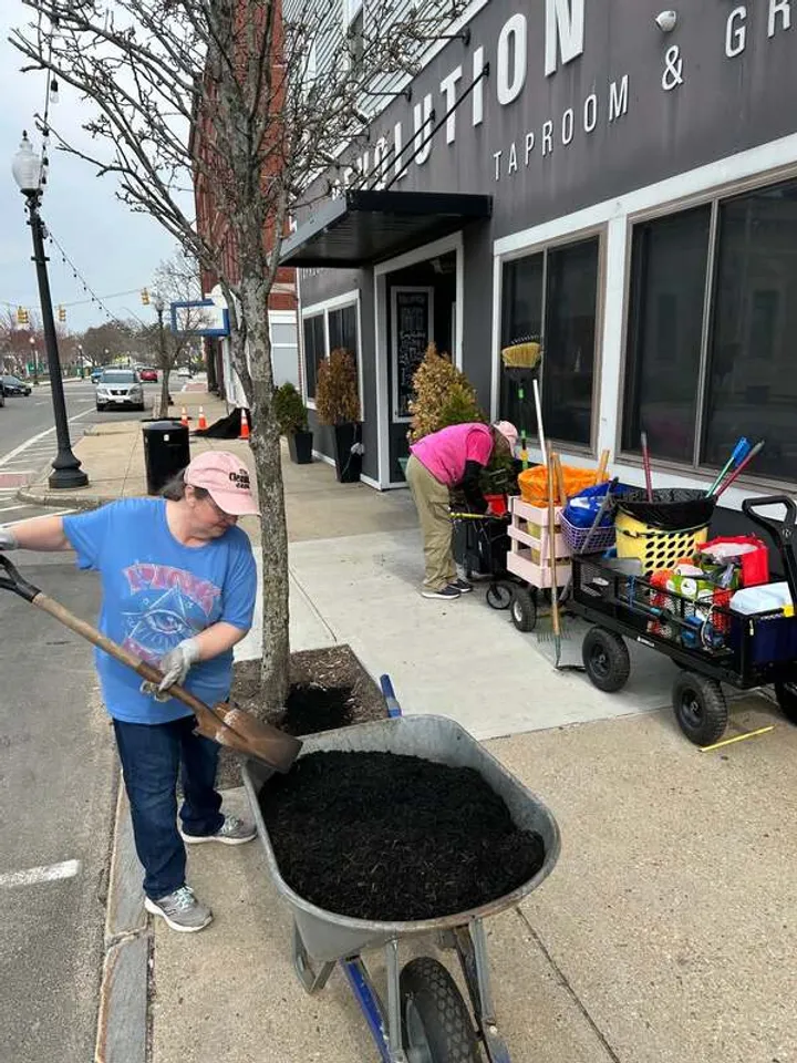 Volunteers maintaining downtown Rochester flower planters